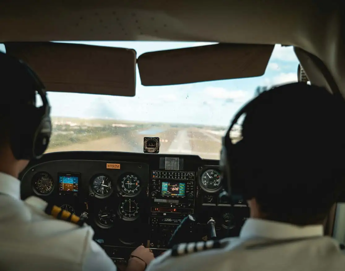 Instructor and student in the cockpit on the runway